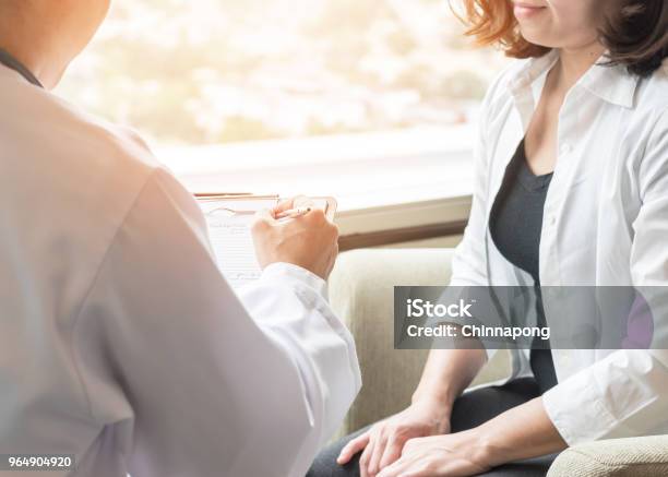 Doctor Consulting And Diagnostic Examining Female Patients On Womanâs Obstetric Gynecological Health In Medical Clinic Or Hospital Healthcare Service Center Stock Photo - Download Image Now