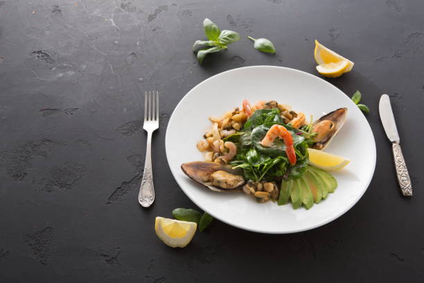 istock Warm salad with grilled seafood flat lay 964910996