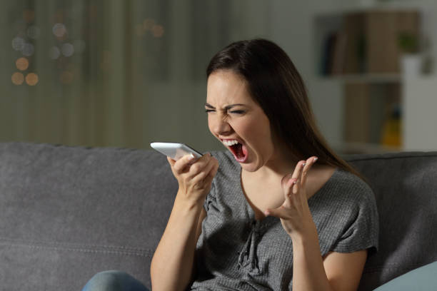 istock Angry woman shouting at the smart phone 964912488