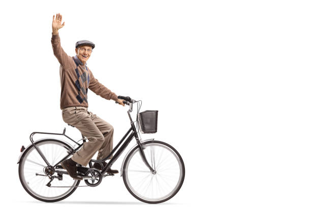 Latin older man aged between 70-80 years old  is using his bicycle