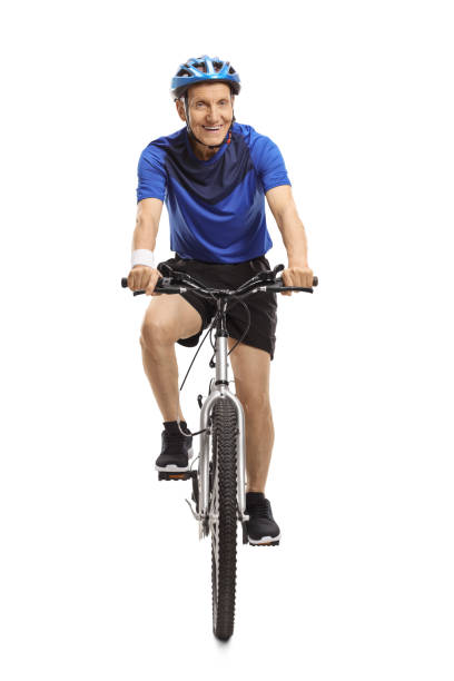 Mature man riding a bicycle isolated on white background