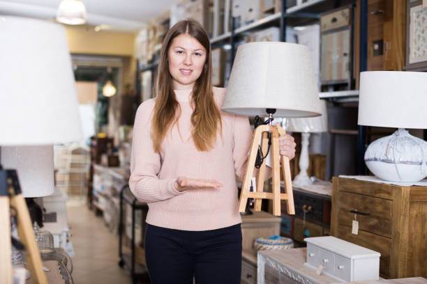 istock Smiling woman consumer choosing torchere 964915826