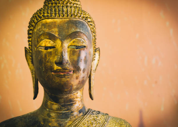 Face of ancient statue Buddha.