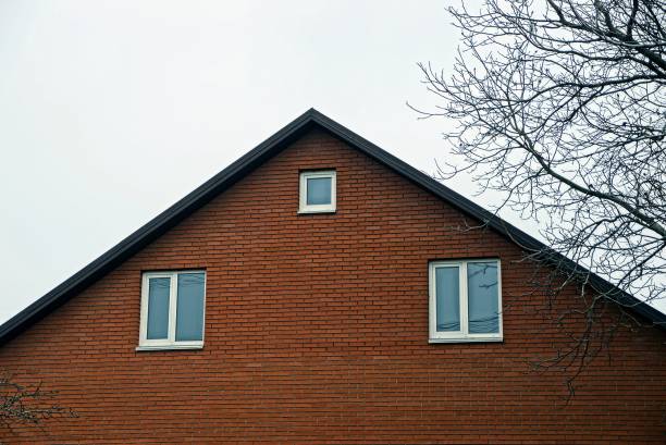 istock Facade of a building with a brick wall and windows 964921250