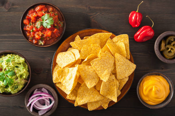istock mexican nachos tortilla chips with guacamole, salsa and cheese dip 964921918