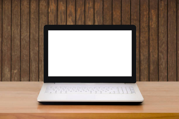 Mock up Laptop with blank screen on wooden table with modern interior background.Mock up business concept.
