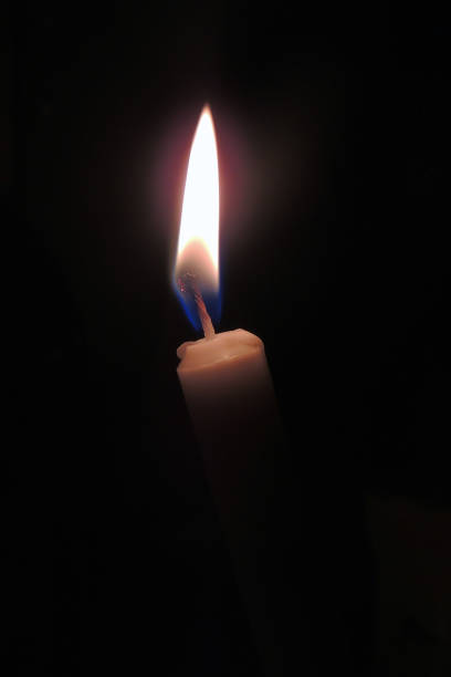 istock The candle is burning. Close-up 964925830