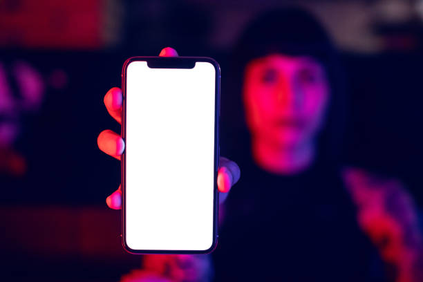 istock Young Woman Showing Blank Smartphone 964928746