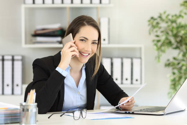 istock Office worker calling on phone looking at you 964929158