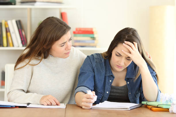 istock Student comforting her frustrated friend 964930382