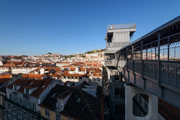 Santa Justa Lift in Lisbon Portugal Lisbon, Portugal - May 03, 2018: Lisbon skyline and the Santa Justa Lift / Elevador de Santa Justa, Lisbon, Portugal. santa justa lift portugal stock pictures, royalty-free photos & images