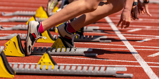 sprint start in track and field feet of some sprinter in sprint start in track and field track and field stock pictures, royalty-free photos & images