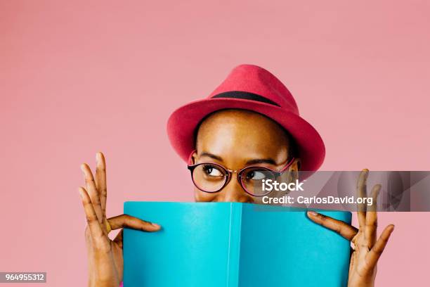 The Reader Portrait Of A Happy Young Woman Full Of Joy Holding A Book Stock Photo - Download Image Now