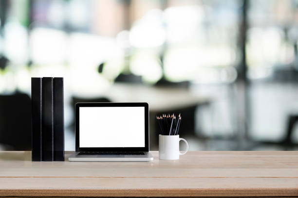 istock Laptop computer mockup with wood desk. 964958742