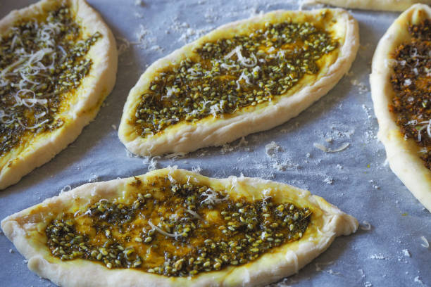 istock Manakish Arabian food before baking in the oven. 964970198