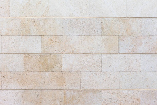 istock Texture of white stone. Accurate masonry of white sandstone. Brick wall. 964972350