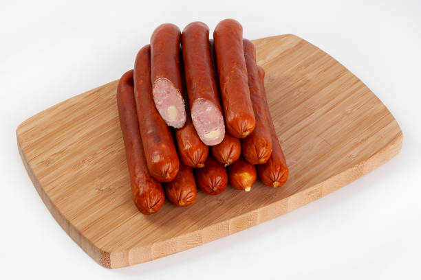 istock Sausages smoked with tomatoes, cucumbers and greens. Served with black or white bread. 964974828