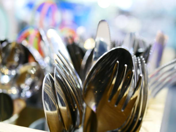 istock Steel spoons and forks 964979960
