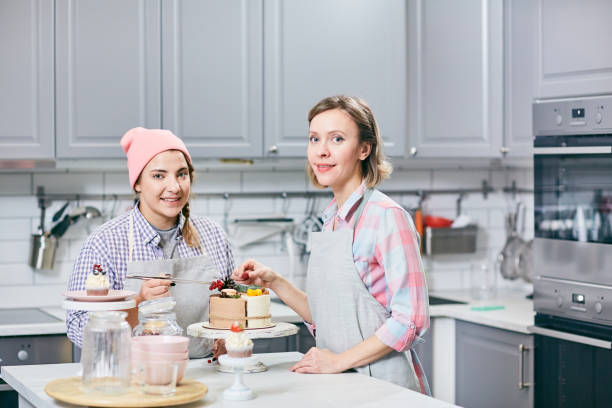 istock Confectioners with delicious cake 964986338