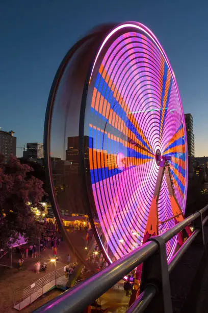 Photo of Ferris Wheel at night during Portland Rose Festival in downtown waterfront colorful long exposure