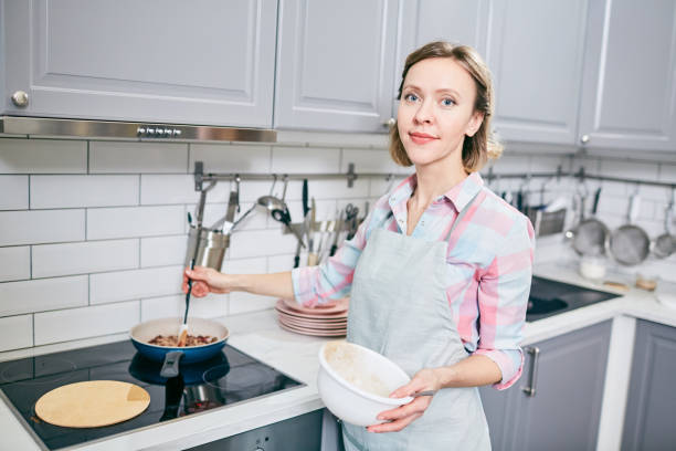 istock Happy housewife in kitchen 964994442