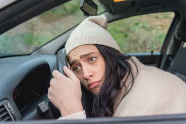 istock Scared woman driver in car. Inexperienced anxious motorist 964999516