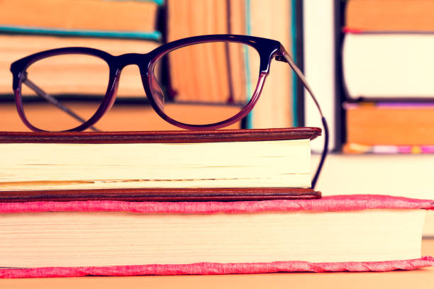 istock Top view of bright colorful hardback books in a circle. 965004106
