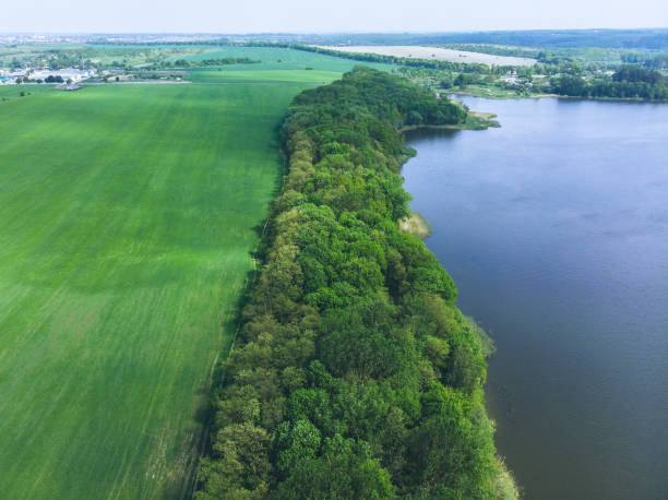istock aerial view of river. small town on background 965006502