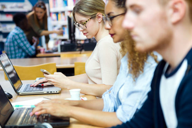 istock Group of friends studying in a university library. 965010698