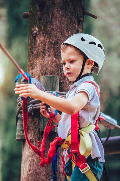 istock Happy boy playing at adventure park on sunny day. 965016056