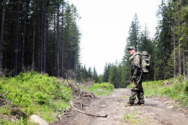 istock Active healthy man hiking in beautiful forest 965019970