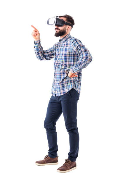 istock Side view of business man with vr glasses push interactive button with finger on virtual screen 965020854