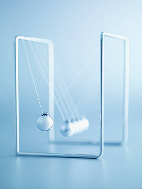 NewtonÃ�s cradle swinging  perpetual motion stock pictures, royalty-free photos & images