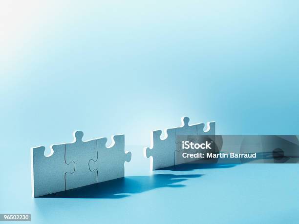 Jigsaw Puzzle Pieces Standing On End Stock Photo - Download Image Now - Mergers and Acquisitions, Incomplete, Puzzle
