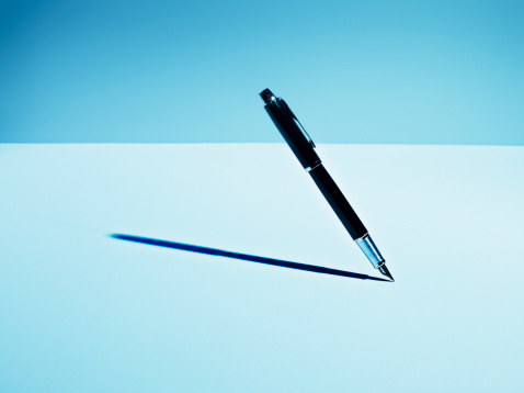 Close up of a modern ballpoint pen isolated on white background.