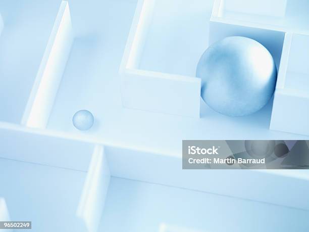 Two Balls In Maze Stock Photo - Download Image Now - Large, Small, Trapped