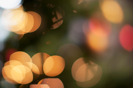 Christmas sparkling background. Beautiful bokeh lights. Space for copy. Can be used as a Christmas / New year holiday border or background.