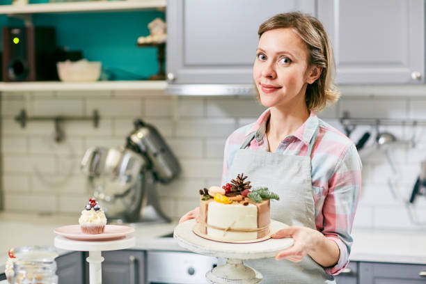 istock Pastry cook with beautiful cake 965024126
