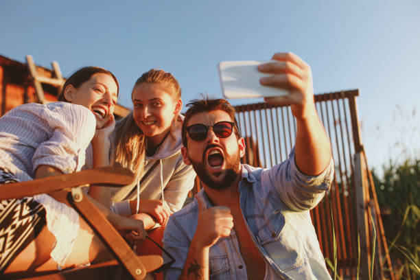 istock Young people taking selfie during the summer sunset 965025292