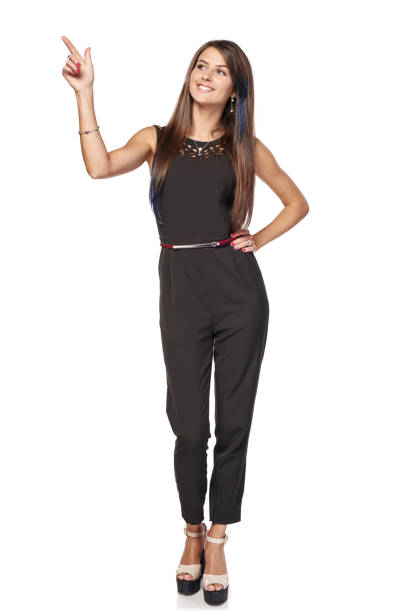 istock Happy business standing pointing to the side 965025756