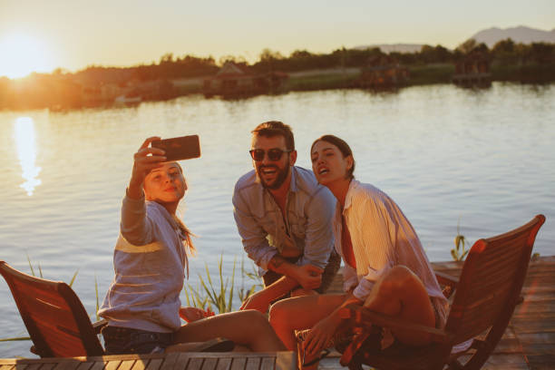 istock Young people taking selfie during the summer sunset 965028198