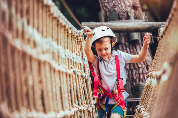 istock Happy boy playing at adventure park on sunny day. 965028602