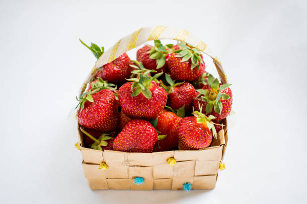 istock Basket of strawberries on white background 965045252