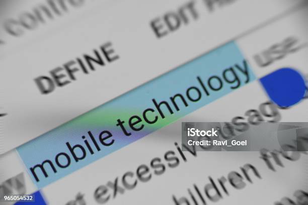Selecting Online Information About Mobile Technology Stock Photo - Download Image Now