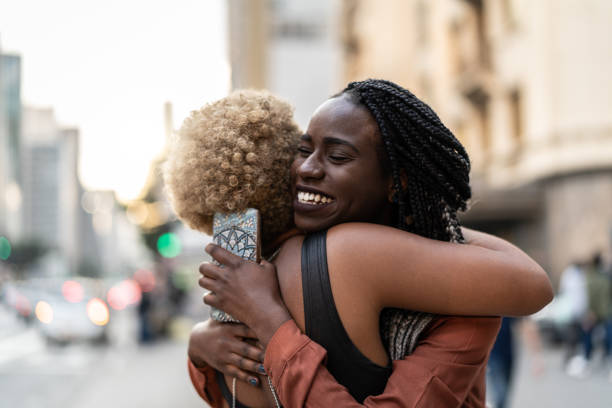 istock Business woman/students embracing 965062562
