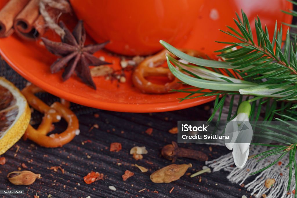 Cup of coffee with cookies Cup of coffee is decorated by cookies, snowdrops and spices on a wooden table Backgrounds Stock Photo