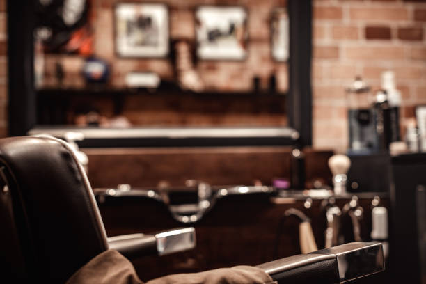 istock Barbershop chair and blurred background 965063136