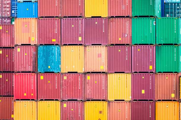 istock Stacked containers in port terminal 965066716