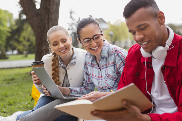 istock Young fellow sharing his excellent notes with his friends 965067268