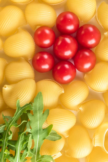 istock Food background Uncooked Macaroni Lumaconi 965067300